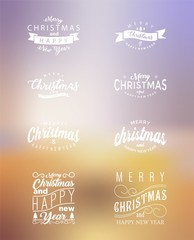 set of christmas calligraphic with blur background