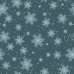 Blue Christmas seamless pattern of snowflakes. Christmas and New Year background. Vector illustration.