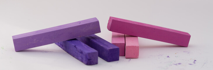 Square colorful pastel chalks tops close up