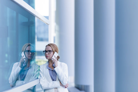 Portrait of beautiful business woman talking on the smartphone outdoor