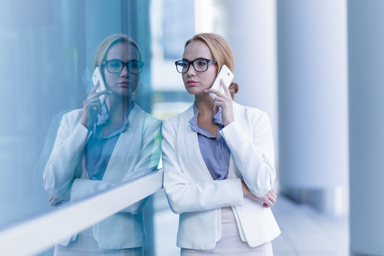 Portrait of beautiful business woman talking on the smartphone outdoor
