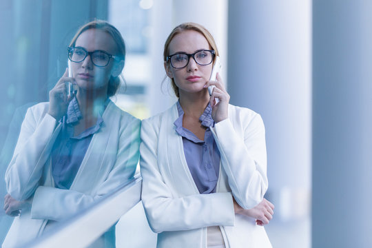 Portrait of beautiful business woman talking on the smartphone outdoor
