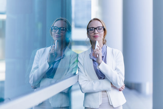 Portrait of beautiful business woman talking on the smartphone outdoor