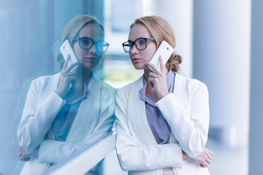Portrait of beautiful business woman talking on the smartphone outdoor