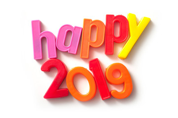 closeup of colorful plastic letters on white background - Happy 2019