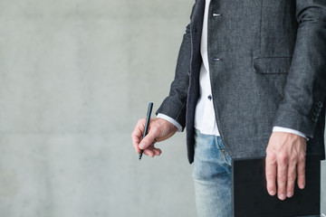 business coach and career training. man holding notebook and pen.