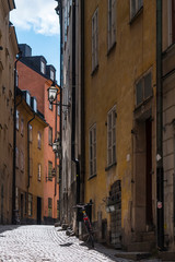 Narrow street with colorful buildings of Old Town in Stockholm, Sweden