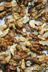 Close-up of shelled walnuts pile. Walnut background.
