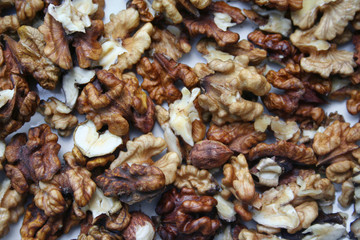 Close-up of shelled walnuts pile. Walnut background.
