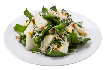 spinach salad with nuts and fruits on a plate, healthy food, on a white background, isolate
