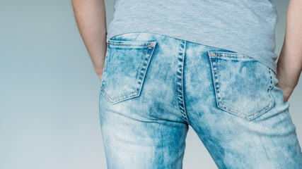 female butt in jeans. seductive shape in blue denim. backview