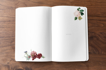 Floral notebook mockup on a wooden table