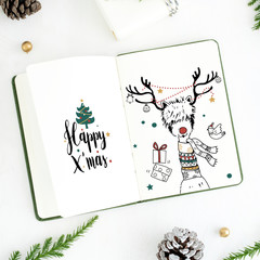 Christmas illustrations in a notebook mockup