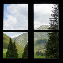 Window with the view of mountain valley. Chocholowska Valley in Tatra Mountains, Poland