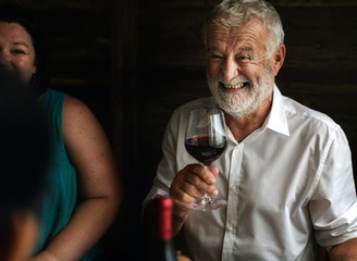 Cheerful man holding a wine glass