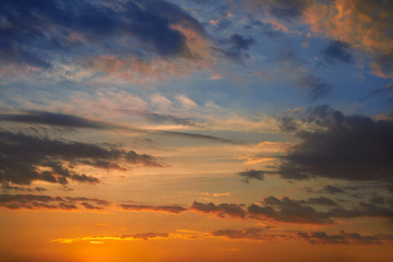 Fototapeta na wymiar Dramatic sunset sky with orange clouds