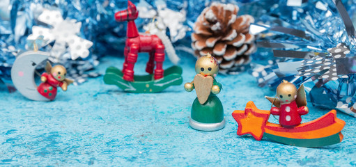 Composition Christmas holidays Christmas toys on a blue background with Christmas decorations. A bunch of Christmas toys and tinsel, while happy waiting for the New Year holidays. New Year card.