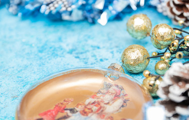 Composition Christmas holidays Christmas toys on a blue background with Christmas decorations. A bunch of Christmas toys and tinsel, while happy waiting for the New Year holidays. New Year card.