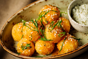breaded cheese balls with sauce