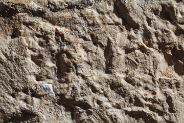 Rough stone texture with big details in harsh light