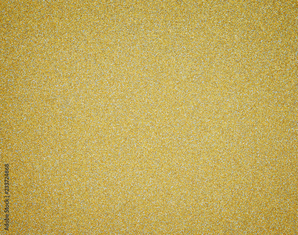 Poster gold glitter full frame textured shiny abstract background with vignetting.