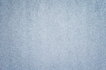 Silver glitter full frame textured shiny abstract background with vignetting.