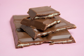 cCose up a chocolate bar isolated on pink background, isolated