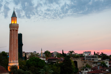 Beautiful colorful sunset over Taurus Mountains, sea and Antalya City in Turkey