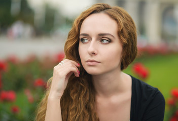 Portrait of attractive young woman with blue eyes.