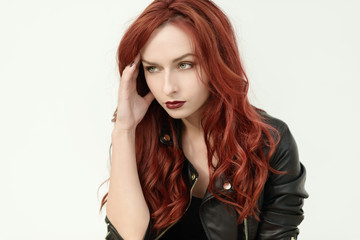Fototapeta premium Portrait of attractive red haired young woman with blue eyes.