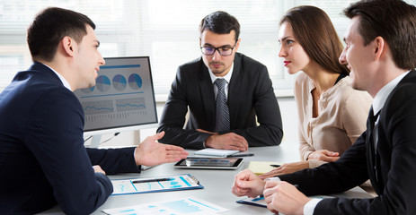 Businesspeople discuss a new project