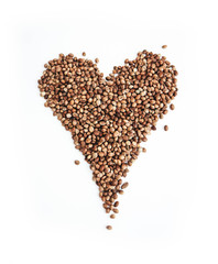 Cannabis seeds isolated on white background. Marijuana grains, herbal health treatment, heart shape.