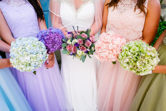 Bride and Bridesmaids holding bouquets