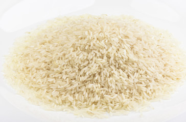 Puffed rice on white plate. Grocery concept.
