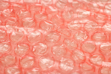 Red Bubble wrap close up, background or texture