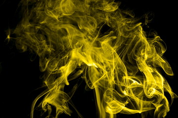 Yellow smoke on black background