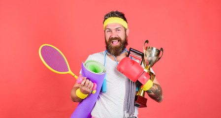 Sport lifestyle concept. My goal is health. Sport shop assortment. Man bearded athlete hold sport...