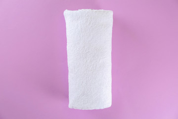Soft towel on color background