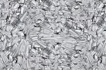 Foto op Aluminium pressed aluminum scrap background and texture, silver metal recycling. © Rattanachat