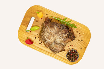 fried pork with vegetables on a white background