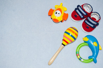 Table top view decoration baby shoes and toys. Flat lay