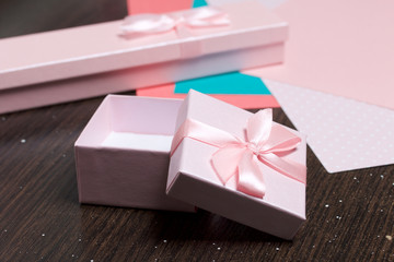 Wrapping presents. Gift boxes. Color paper for packaging.