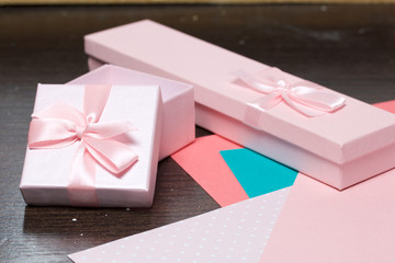 Wrapping presents. Gift boxes. Color paper for packaging.
