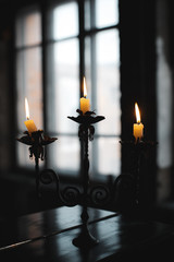 burning candles on a candlestick
