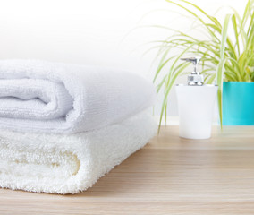 Obraz na płótnie Canvas Clean Towels on wood top table in bathroom