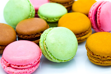 Sweet colorful macarons isolated on white background close up
