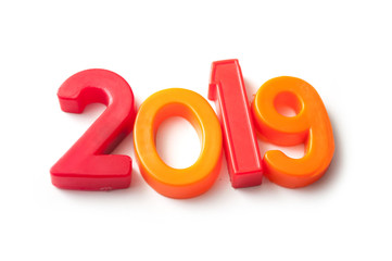 closeup of colorful plastic letters on white background - 2019