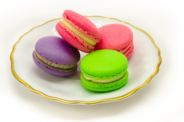 Macarons on a plate. White background