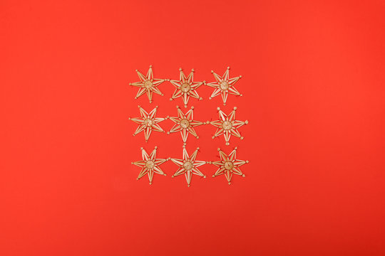Gold stars christmas decoration on a red background