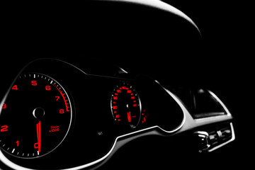 Close up shot of a speedometer in a car. Car dashboard. Dashboard details with indication lamps.Car...